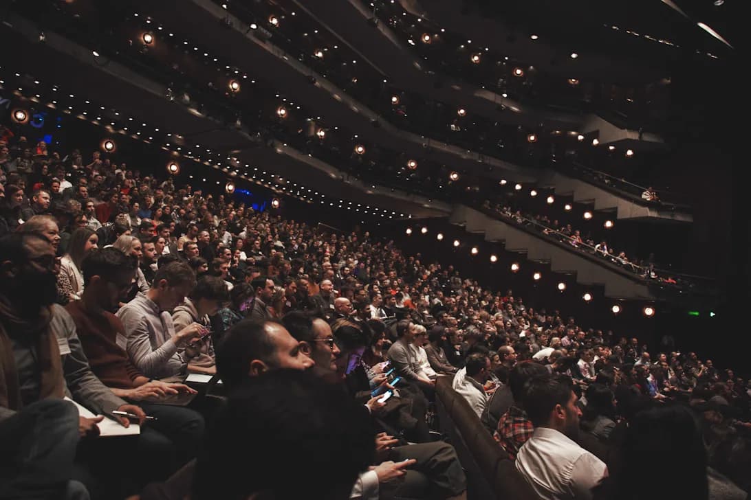 Audience seated in a conference auditorium